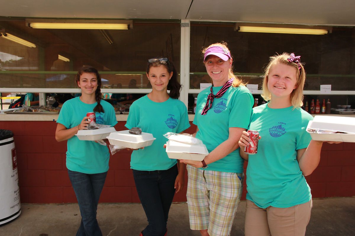 Girls from Camp Duncan and Chief Tina took time out for a barbecue lunch that was provided for a donation.