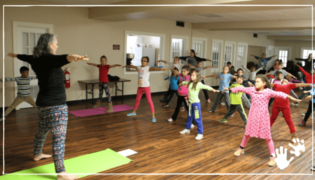 Weekday Education children exercise and meditate with Christ