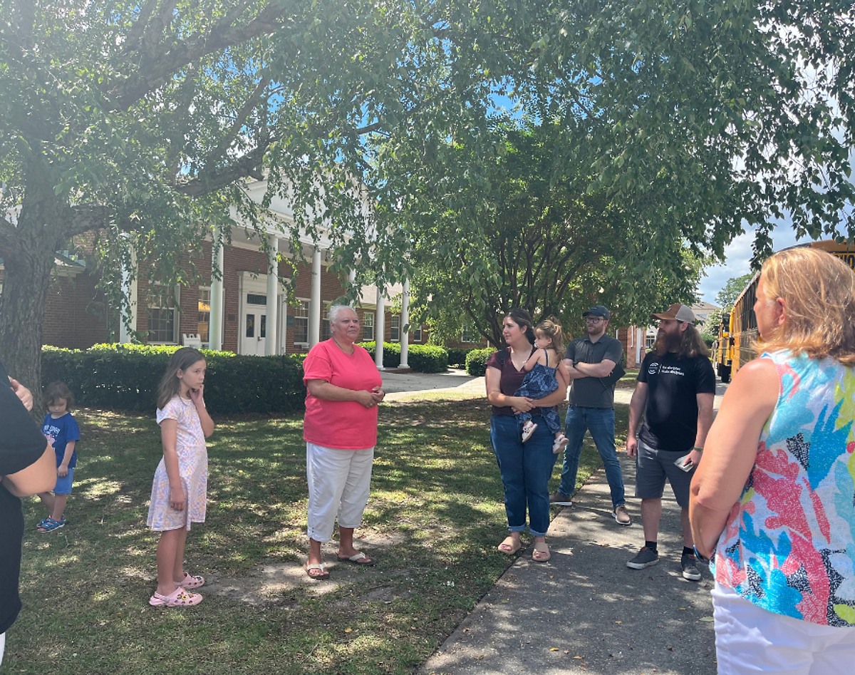 Odum Home director Kathy Locklear welcomes members from Crossroads Church Benson.