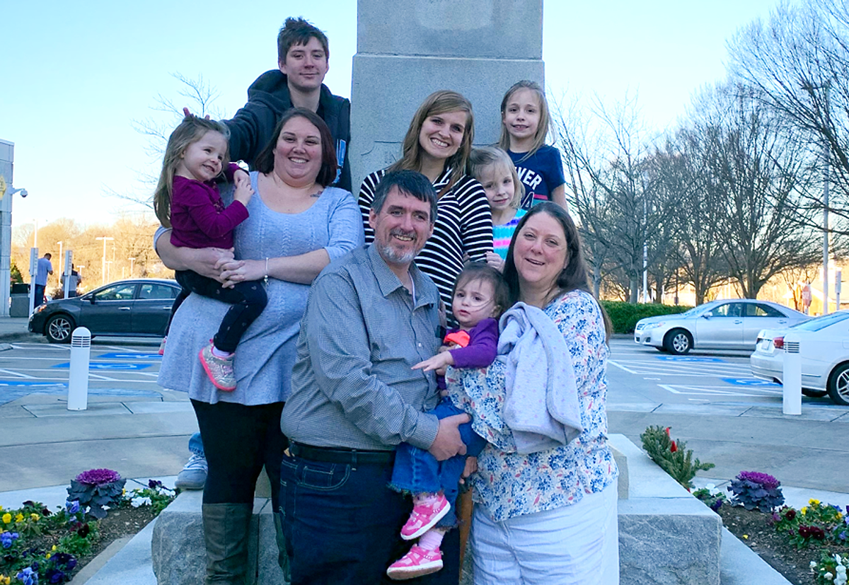 The Clines, the sisters, and BCH’s Krystal Saunders and Rae Francis stand outside the Gaston County courthouse after adoption papers were signed.