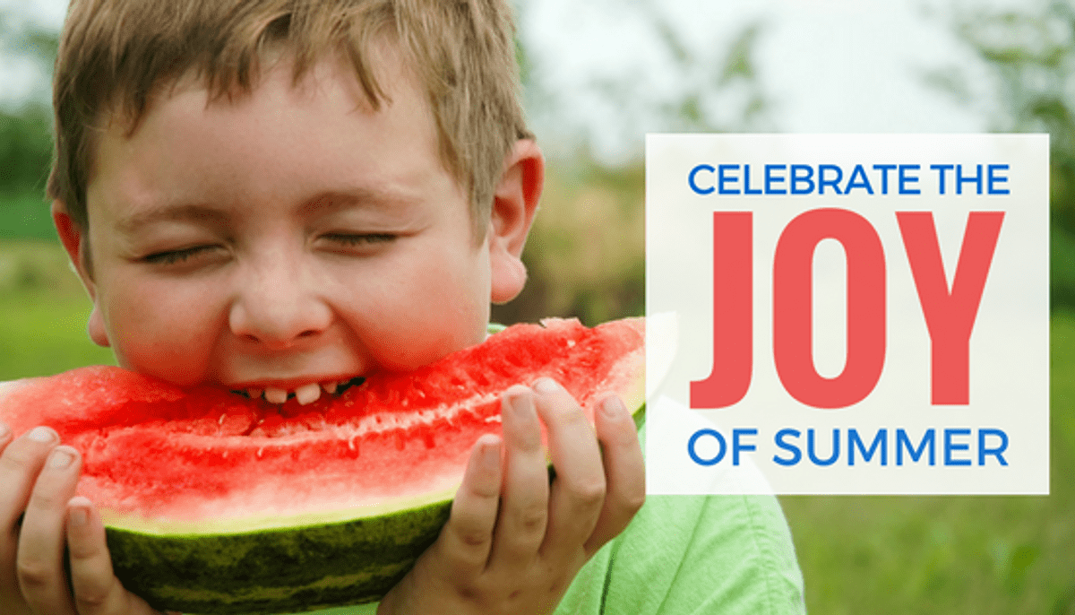 Boy biting into watermelon with delight