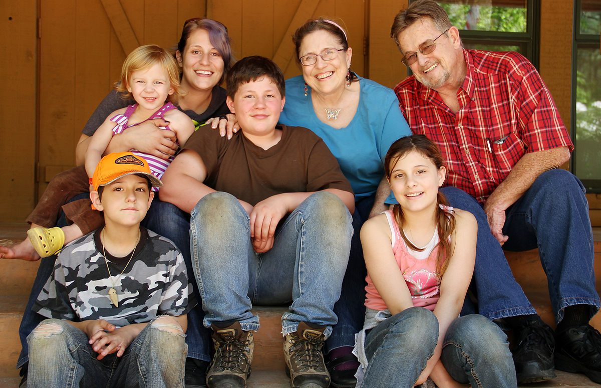 Brandon, resident at Cameron Boys Camp in Cameron, NC, is surrounded by his supportive family