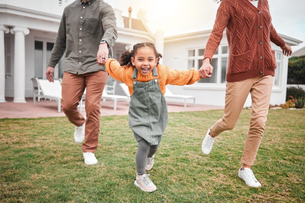 Happy family playing outside
