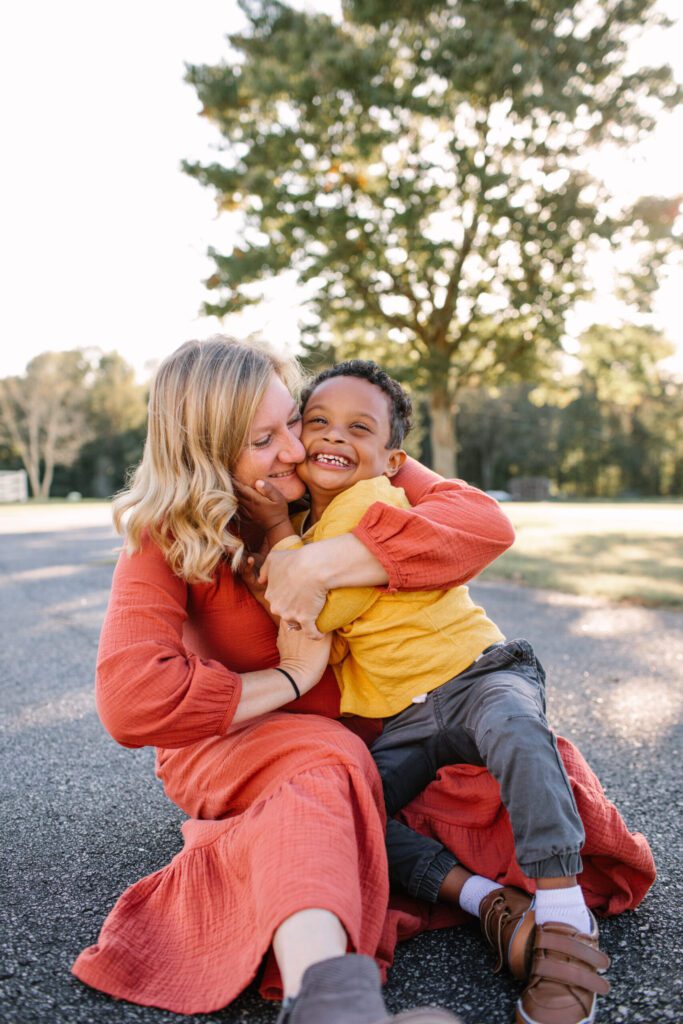 Mother embracing her son who has Down syndrome