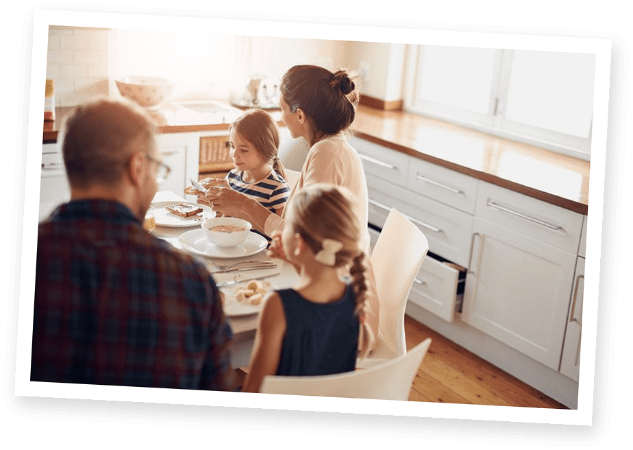 A cottage family sharing a meal together at BCH