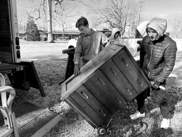 Volunteers working together outdoors during a Friends of Children workday