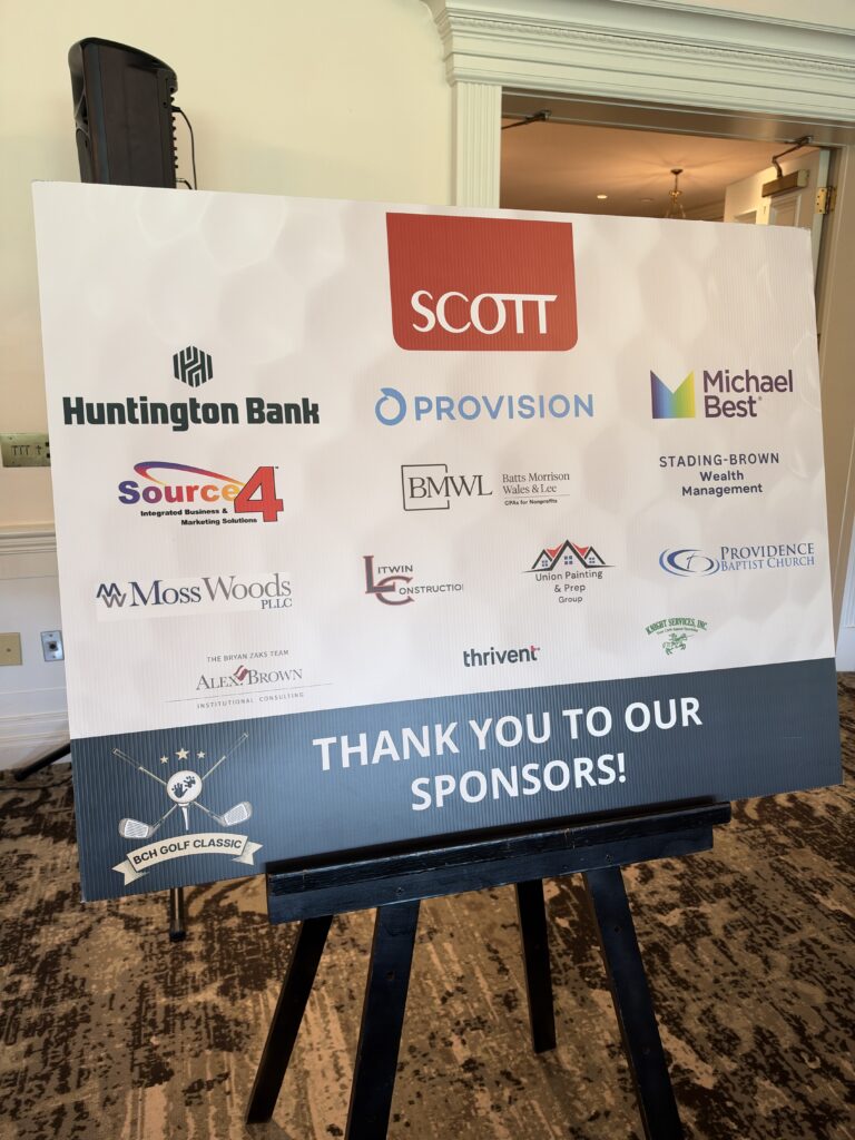 Sign reading "Thank You to Our Sponsors!" with sponsor logos at the BCH Golf Classic at Sedgefield Country Club.