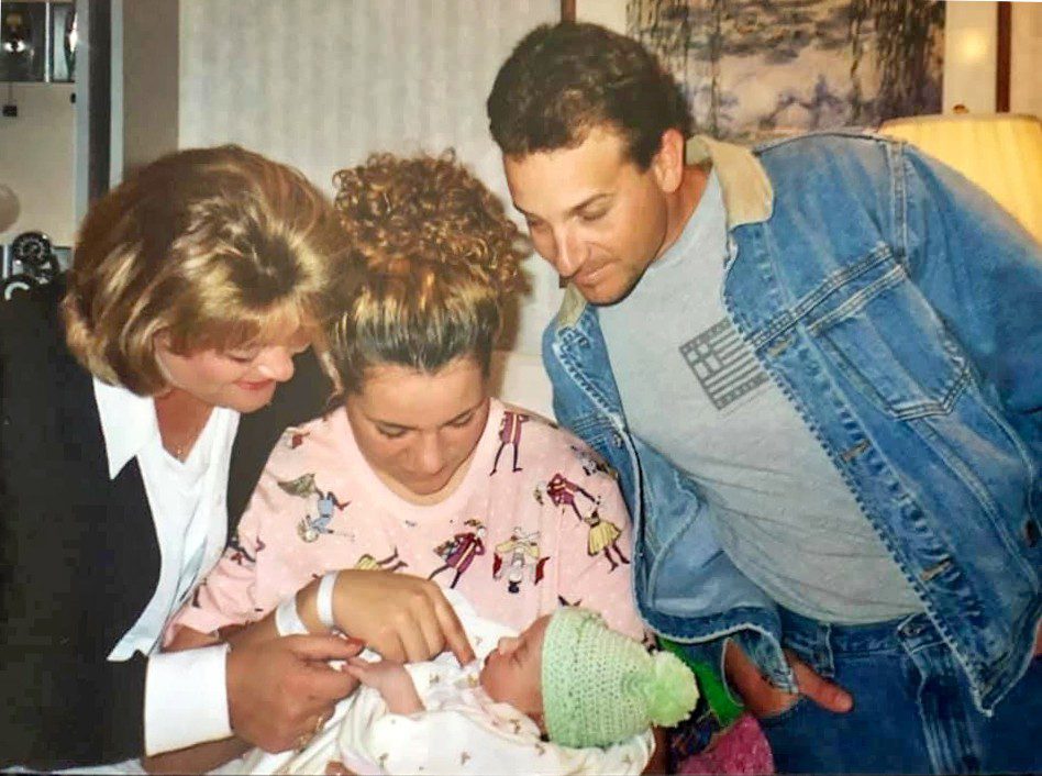 Noelle with baby Olivia and adoptive parents Robin and Sam at the hospital.