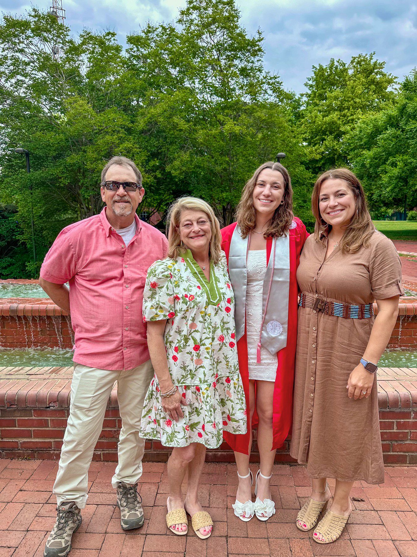 Sam, Robin, and Noelle celebrate Olivia’s graduation.